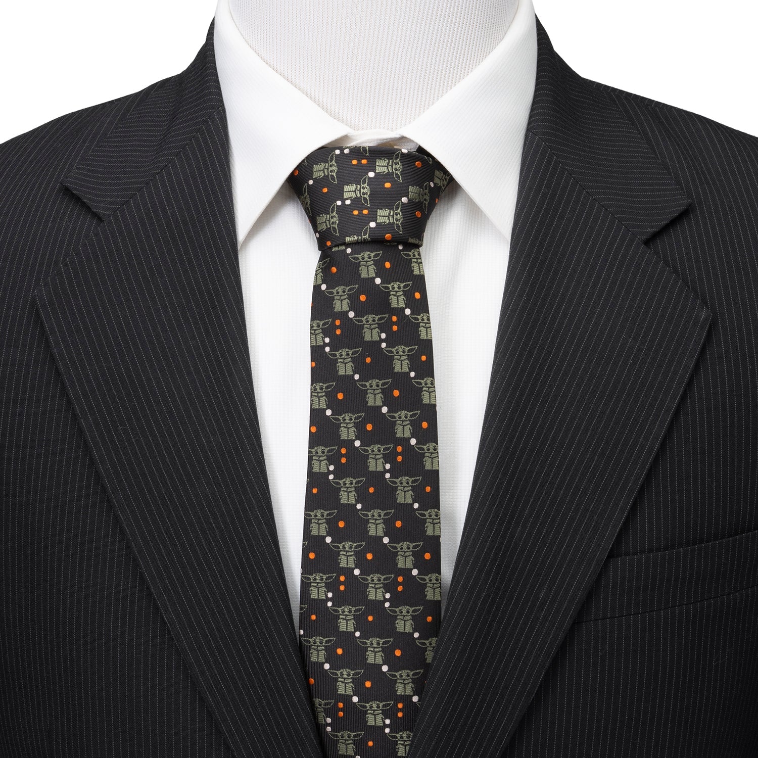 Close-up of the Grogu character pattern and orange dot details on the black necktie