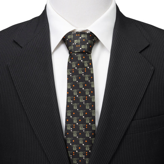 Close-up of the Grogu character pattern and orange dot details on the black necktie