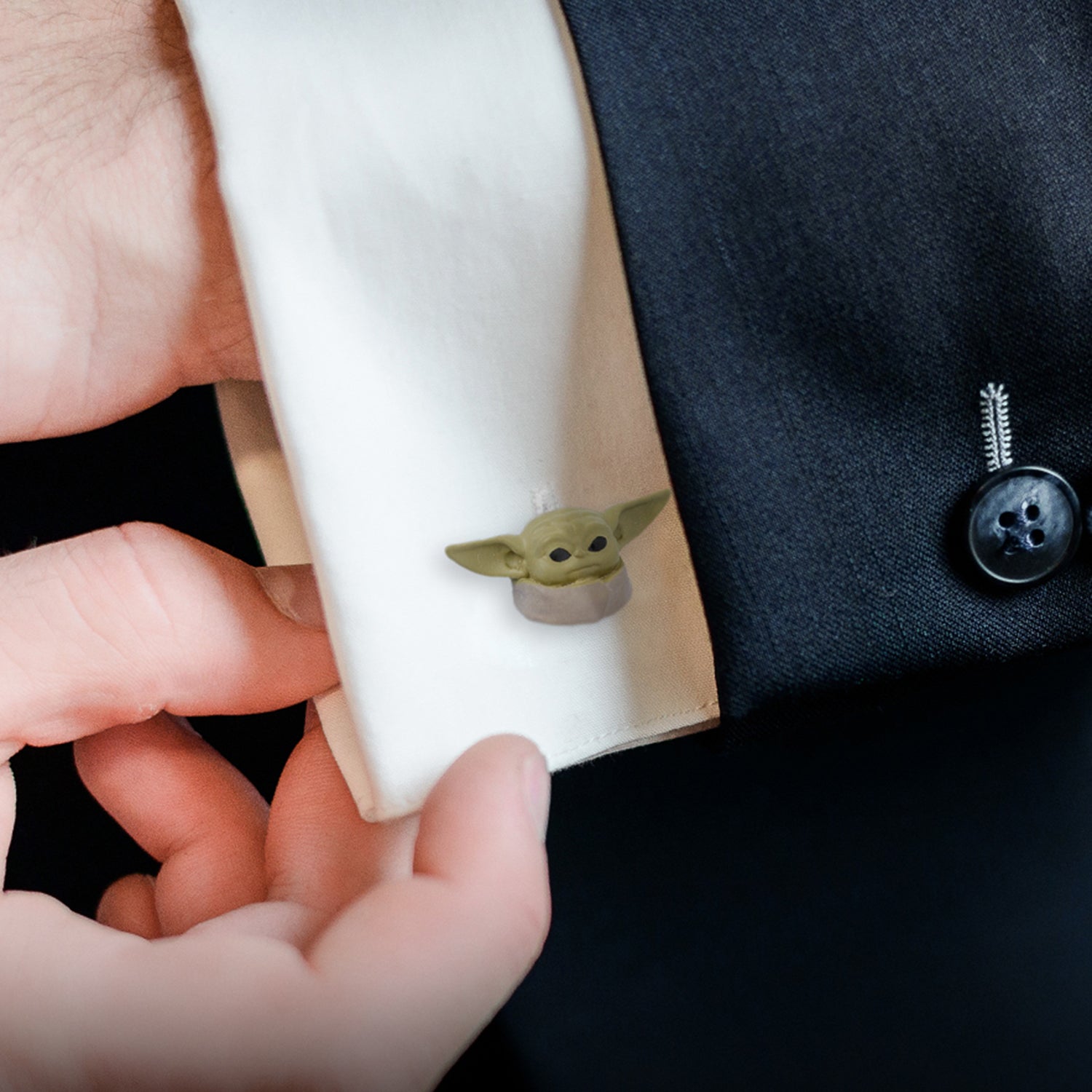 Pair of Grogu cufflinks displayed together on a white background.