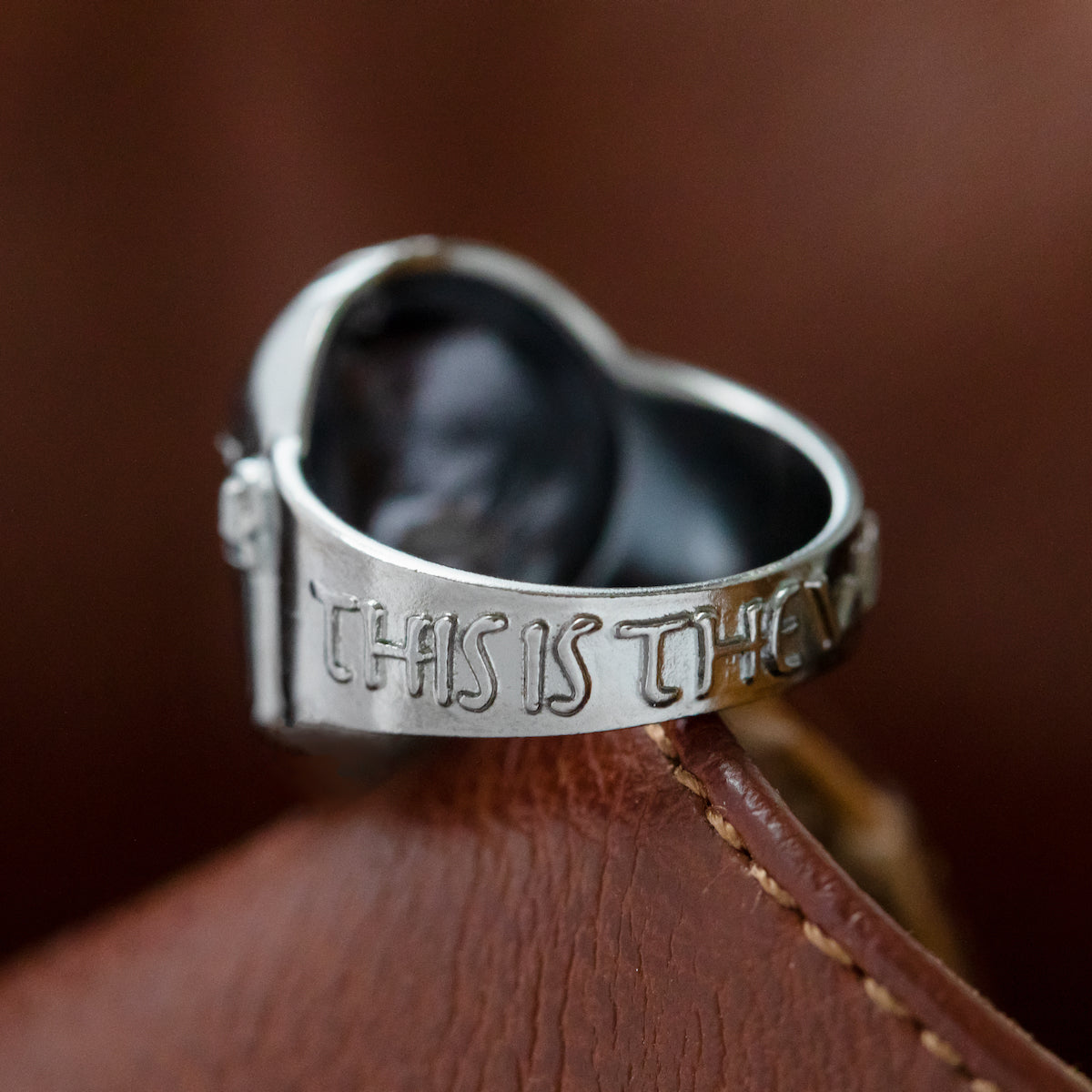 Comparison view of the Mandalorian ring next to official packaging.