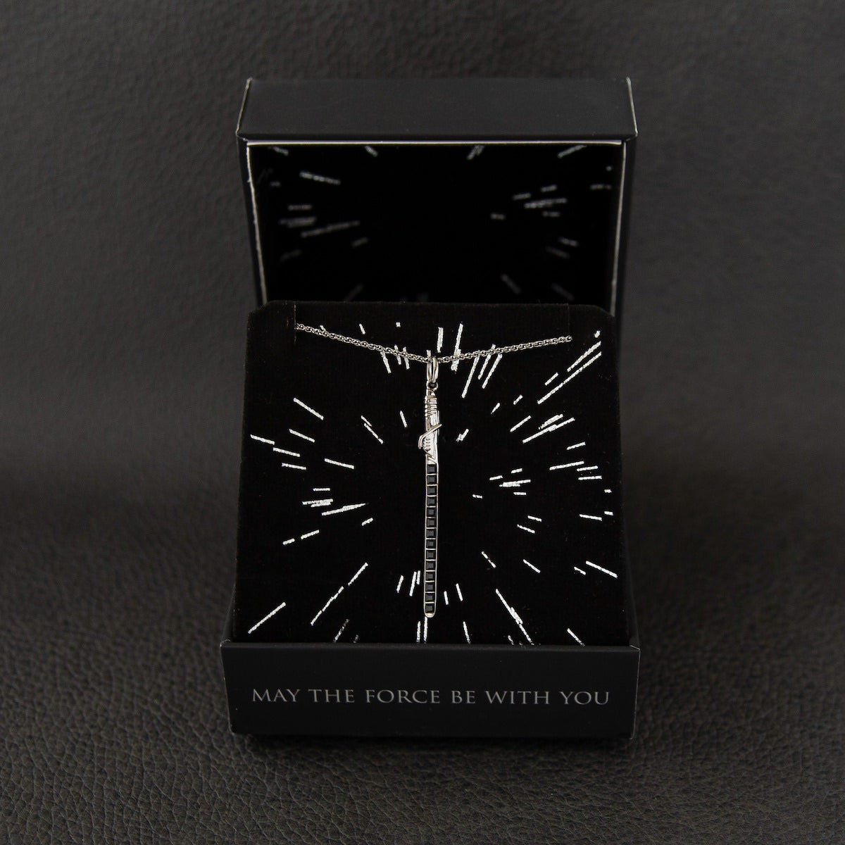 Star Wars | RockLove branded jewelry box with the Darksaber necklace inside.