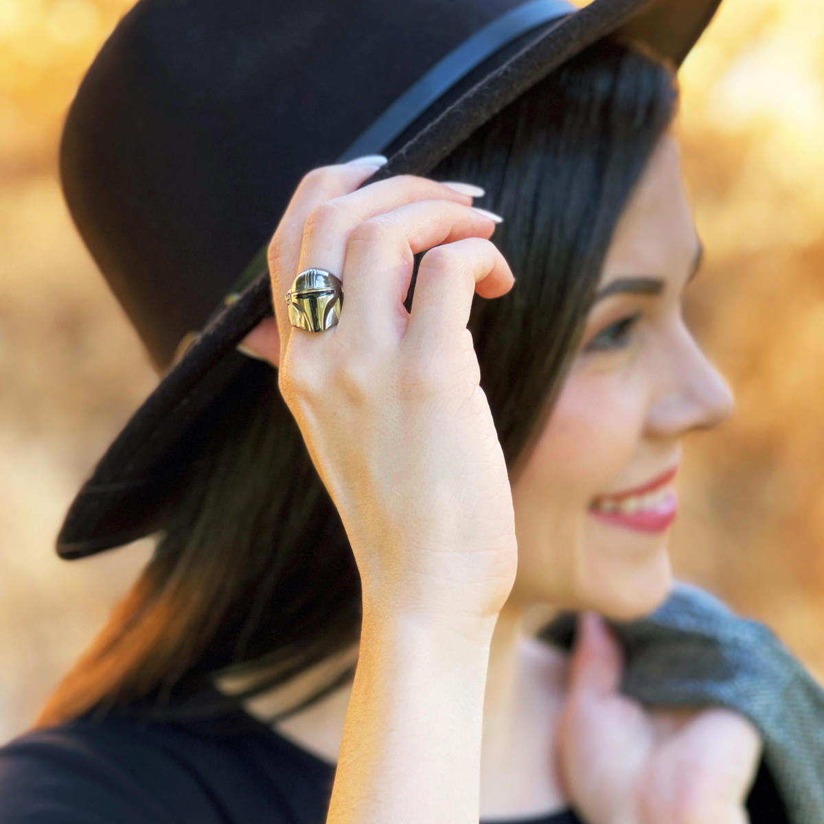 A person wearing the gunmetal rhodium Mandalorian ring.